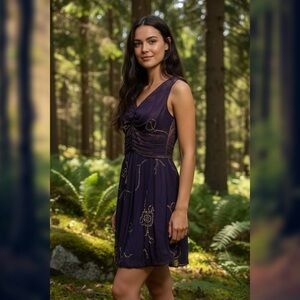 Woman’s purple medium Kisimet dress with gold embroidered details